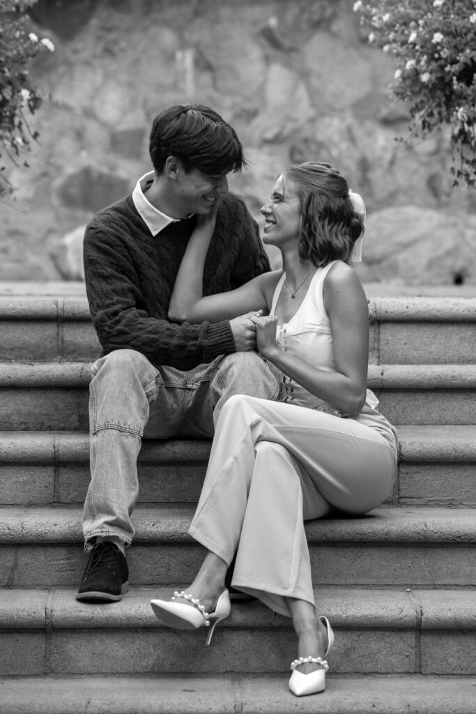Sweet couple having fun together during an engagement session at V. Sattui Winery in Napa California. 