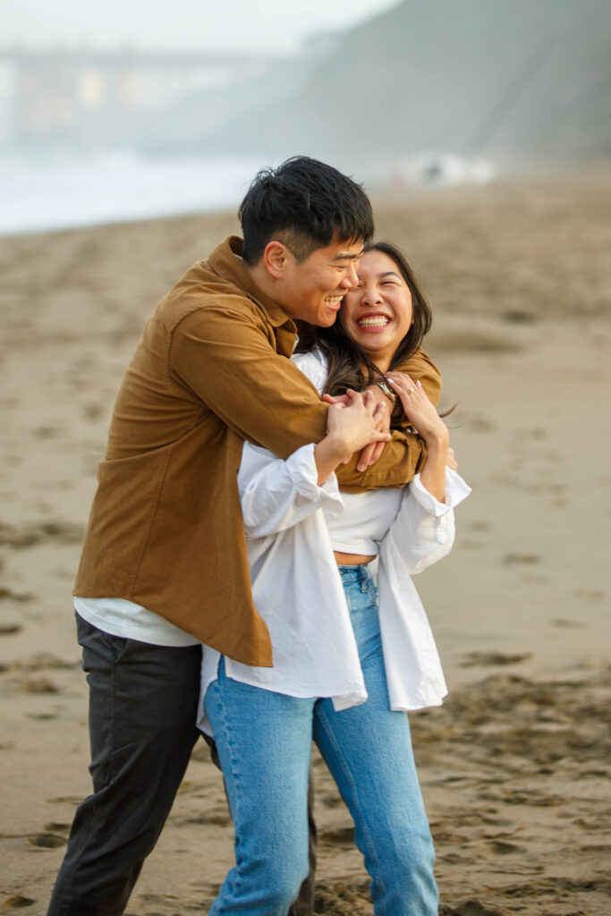 Fun, cute couple on the beach