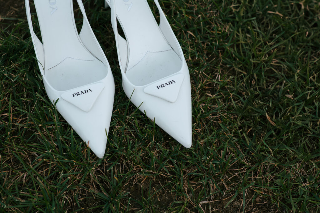 Prada shoes on grass at wedding