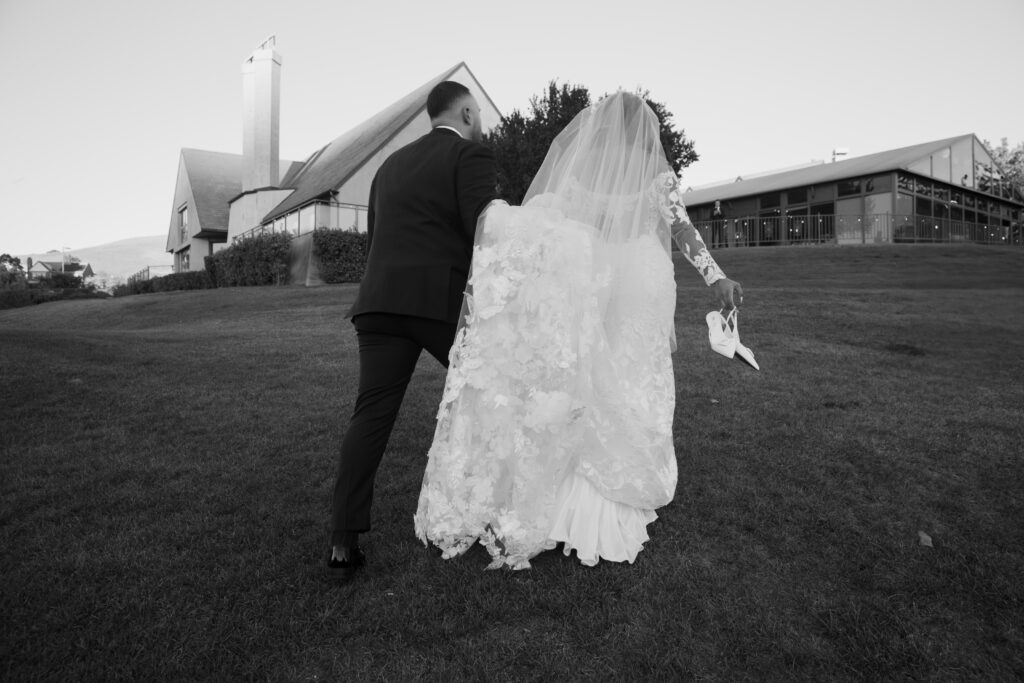 Bride and groom walking to venue 