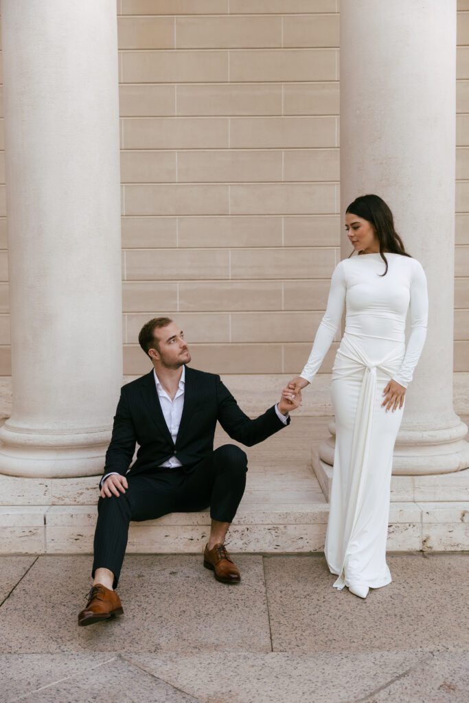 Elegant couple photographed by an engagement photographer San Francisco on the grand staircase of the Legion of Honor.