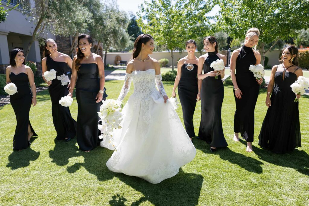 Bride and bridesmaids in black gowns at Meritage Resort Napa Valley black tie wedding