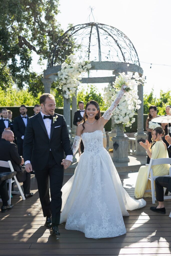 Bride walking down the aisle at outdoor Meritage Resort Napa wedding ceremony