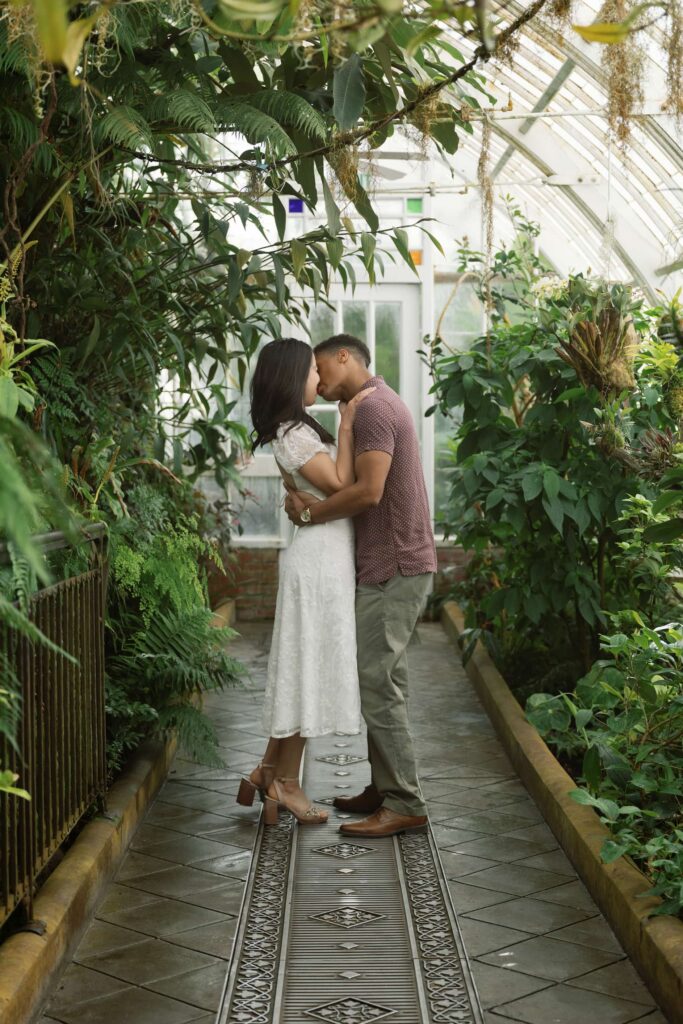 Couple forehead to forehead inside Conservatory of Flowers San Francisco, Bay Area engagement photographer