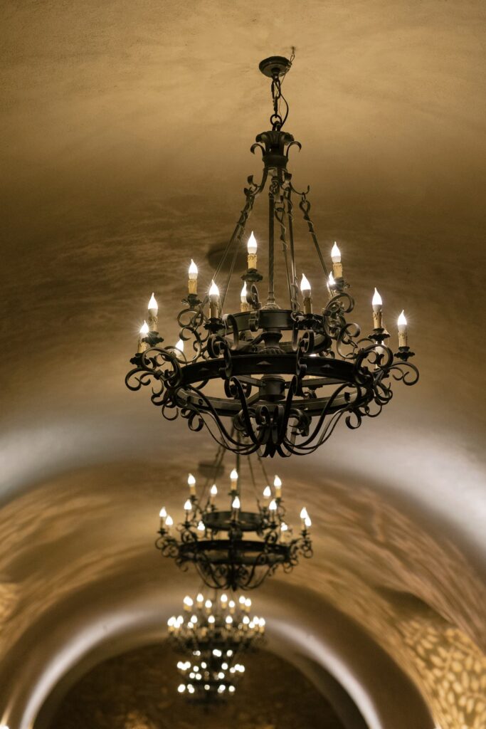 Iron chandelier hanging in cave ceiling at Meritage Resort and Spa Napa Valley wedding reception