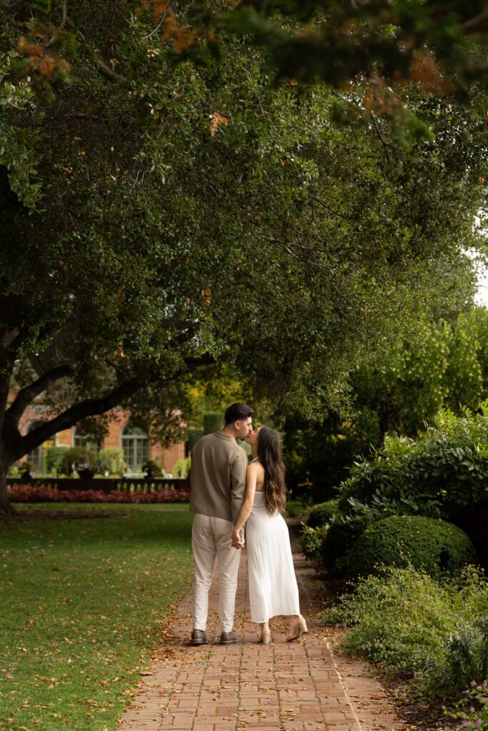 Couple kissing on garden path at Filoli Estate Woodside California, Bay Area engagement photographer
