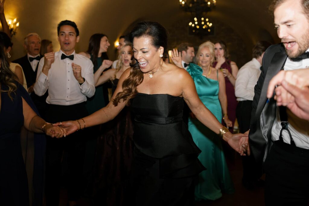 Wedding guest dancing and laughing at Meritage Resort Napa Valley reception