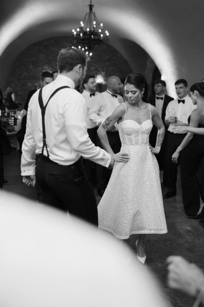 Bride and groom dancing surrounded by guests at Meritage Resort Napa Valley vineyard