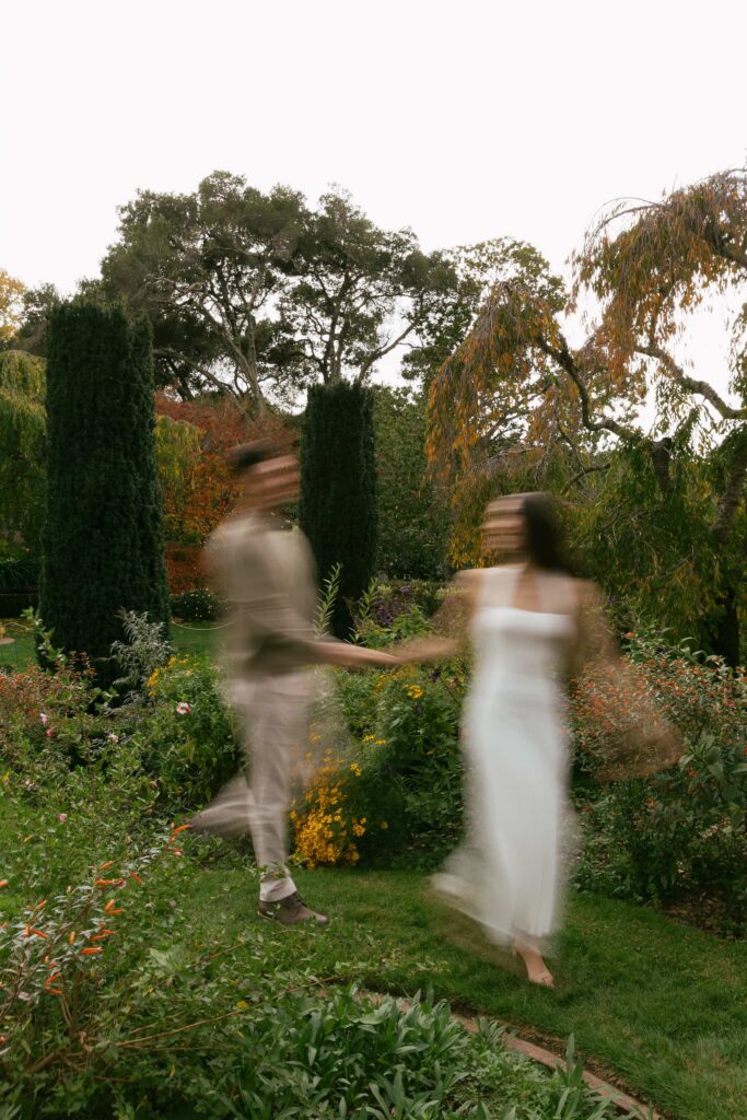 Motion blur engagement portrait in Filoli Estate gardens, San Francisco Peninsula engagement photographer Rose Freedman