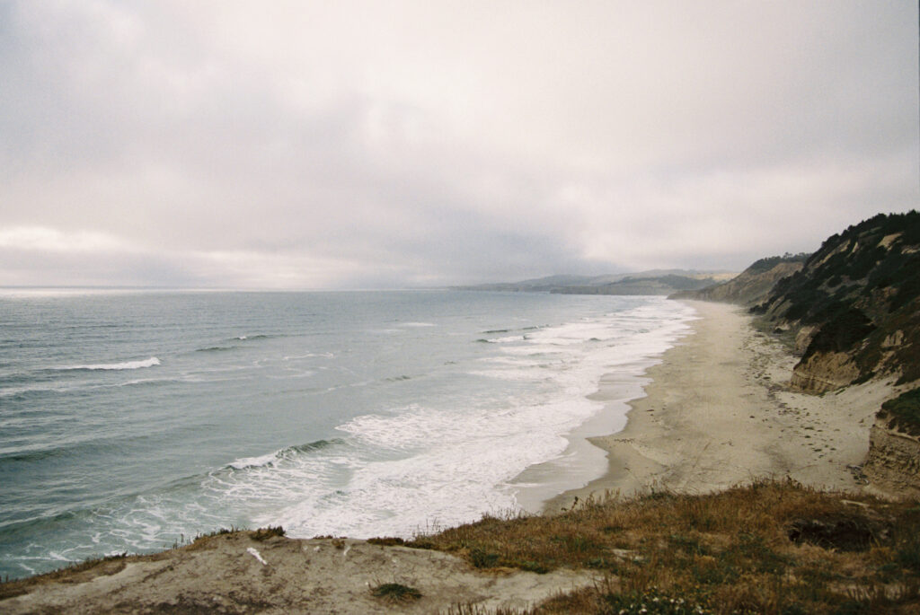Half Moon Bay coastline on 35mm film with moody overcast sky and waves, Bay Area photographer Rose Freedman