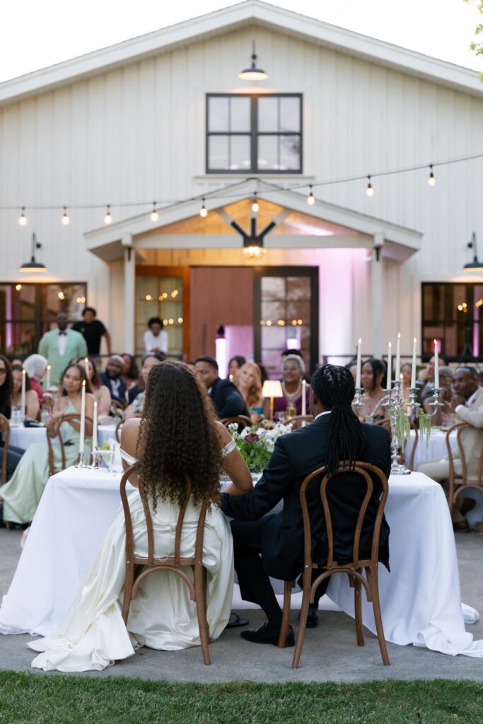 Park Winters white barn exterior with string lights at wedding reception, Park Winters wedding photographer Rose Freedman