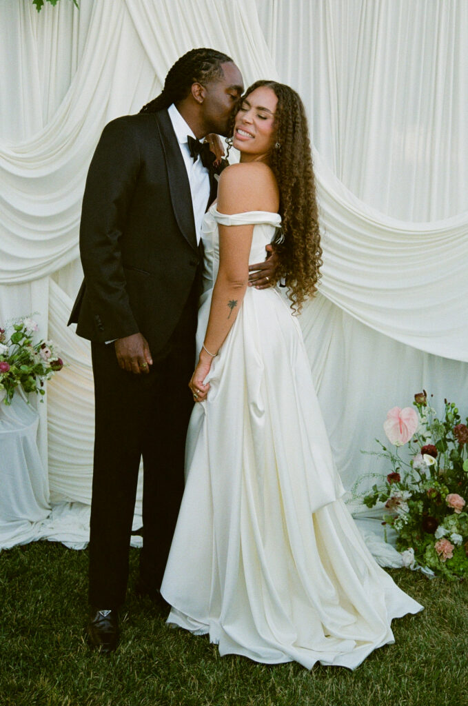 Bride and groom portrait against white draping at Park Winters wedding, Park Winters wedding photographer Rose Freedman