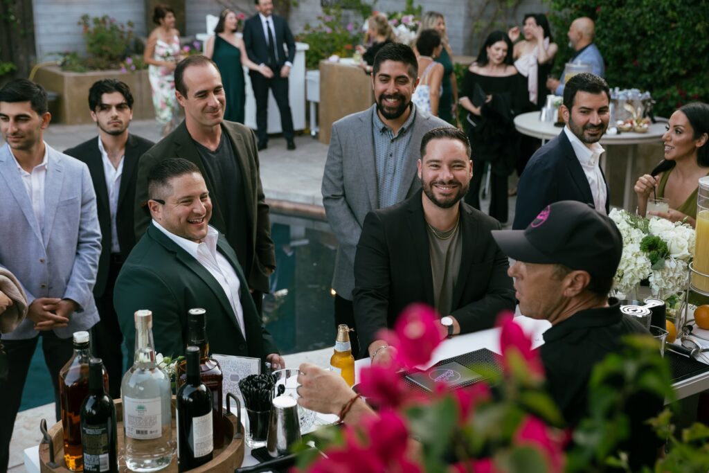 Guests mingling at cocktail hour at Los Gatos private estate engagement party, Bay Area engagement party photographer Rose Freedman