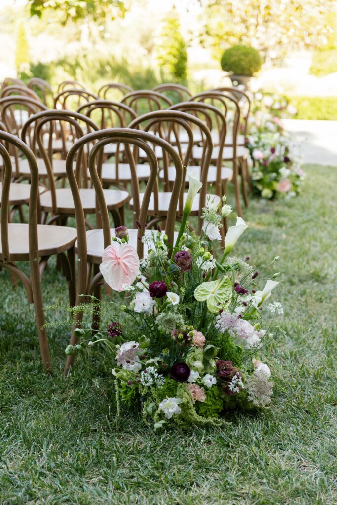 Lush garden aisle floral arrangement with anthurium and ranunculus at Park Winters wedding, Park Winters wedding photographer Rose Freedman