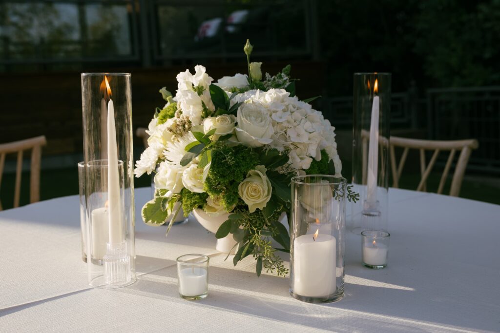 White rose and hydrangea centerpiece with candle at Los Gatos engagement party, Rose Freedman Photography