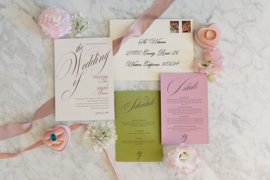 Park Winters wedding invitation suite with calligraphy, emerald ring, and florals on marble, Park Winters wedding photographer Rose Freedman