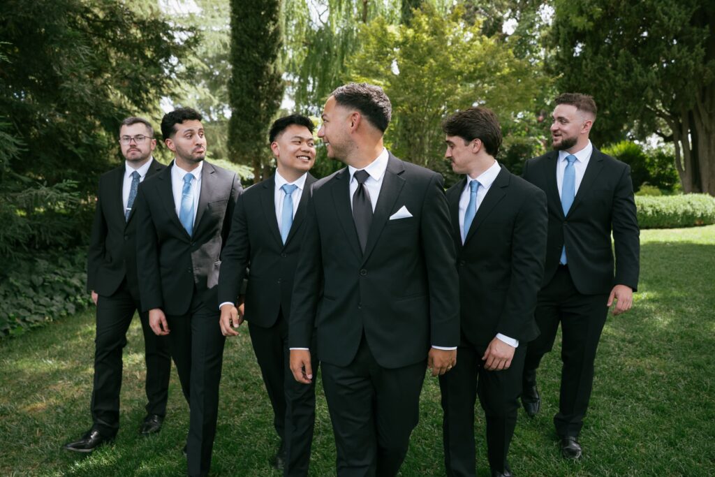 Groom and groomsmen in black suits with blue ties at Park Winters wedding, Bay Area wedding photographer Rose Freedman