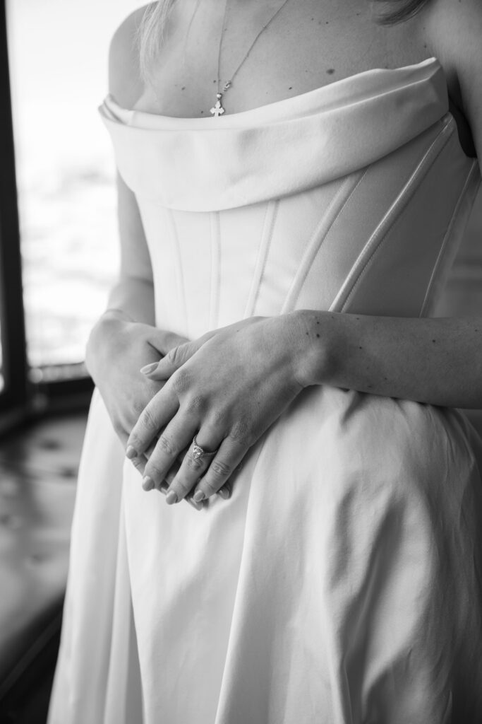 Bride's structured gown bodice and diamond necklace detail at Flood Mansion wedding, San Francisco wedding photographer Rose Freedman