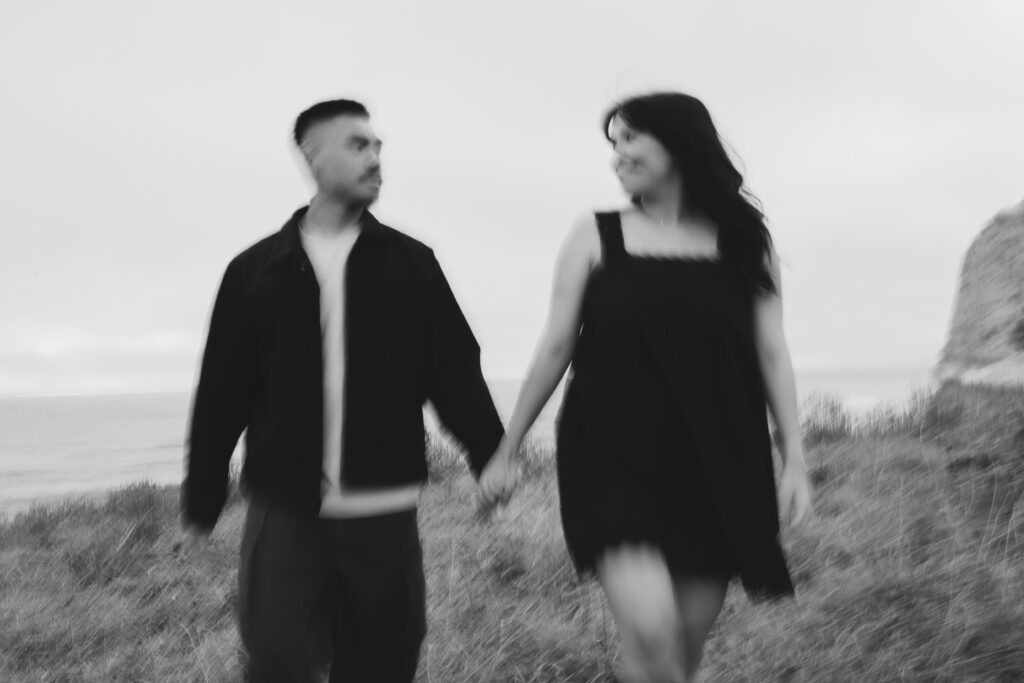 Artistic motion blur black and white portrait of couple walking at Half Moon Bay, Bay Area photographer Rose Freedman
