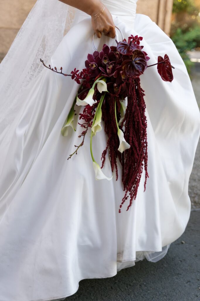 Cascading burgundy orchid and amaranthus bridal bouquet at Palace of Fine Arts wedding, San Francisco wedding photographer Rose Freedman