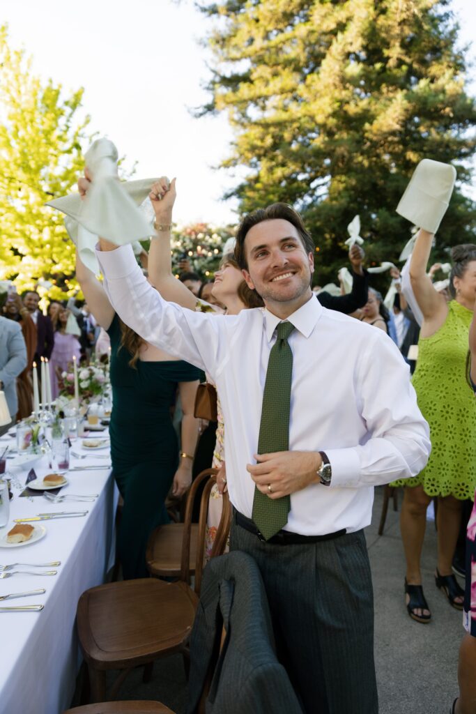 Wedding guest celebrating at Park Winters outdoor reception dinner, Rose Freedman Photography