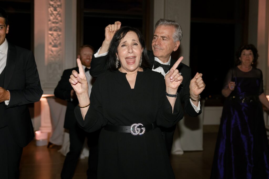 Guests celebrating on the dance floor at Flood Mansion wedding reception, San Francisco wedding photographer Rose Freedman
