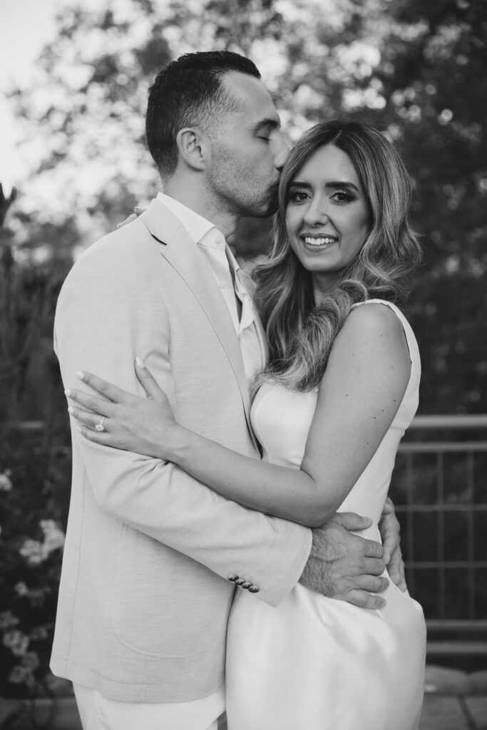 Engaged couple embracing at Los Gatos private estate engagement party, Bay Area engagement party photographer Rose Freedman