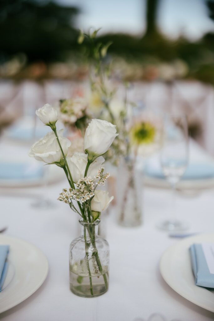 White rose and baby's breath table centerpiece at Park Winters wedding reception, Bay Area wedding photographer Rose Freedman