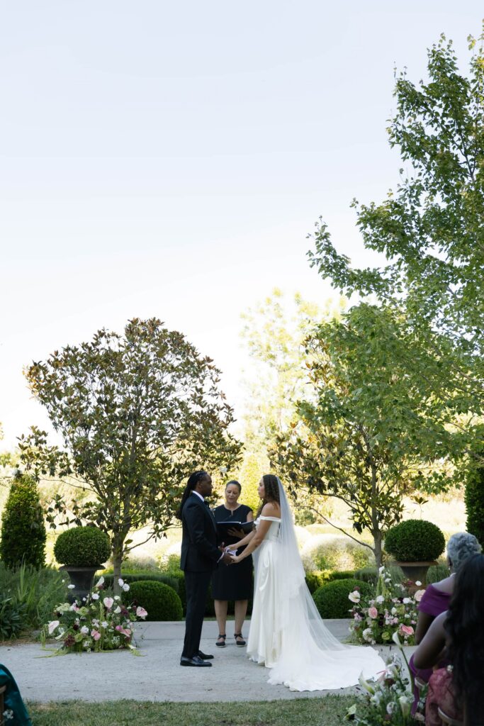 Bride and groom exchanging vows at Park Winters garden ceremony, Park Winters wedding photographer Rose Freedman
