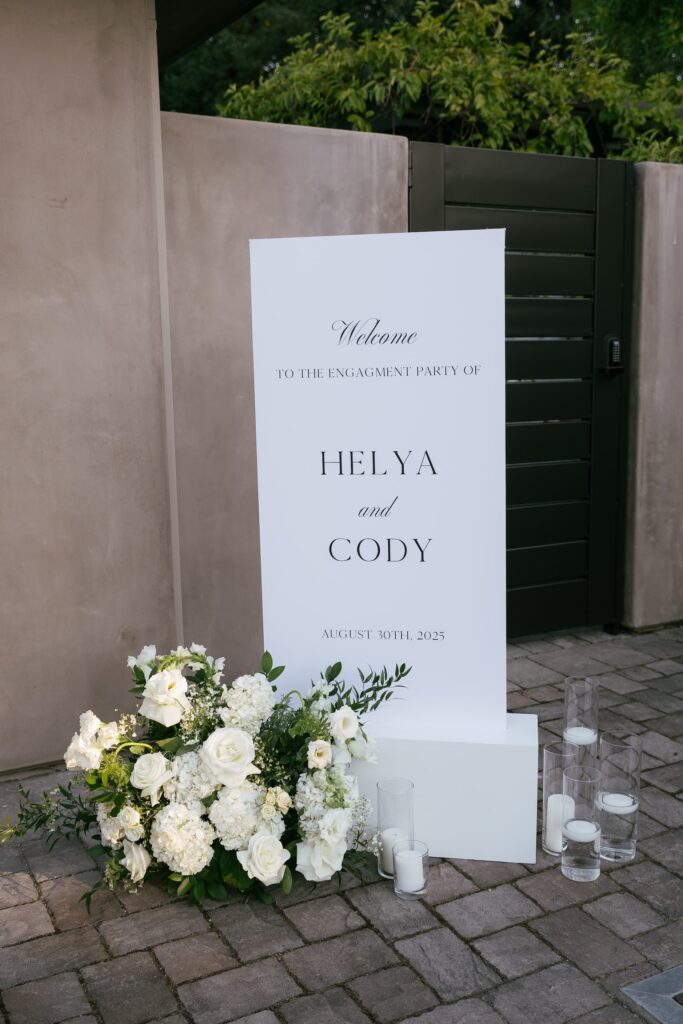 Helya and Cody engagement party welcome sign with white florals at Los Gatos private estate, Rose Freedman Photography
