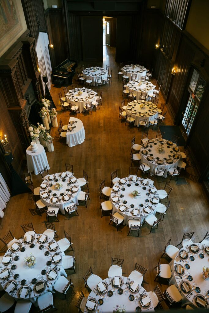 Aerial view of candlelit reception hall at Kohl Mansion Burlingame, Peninsula wedding photographer Rose Freedman