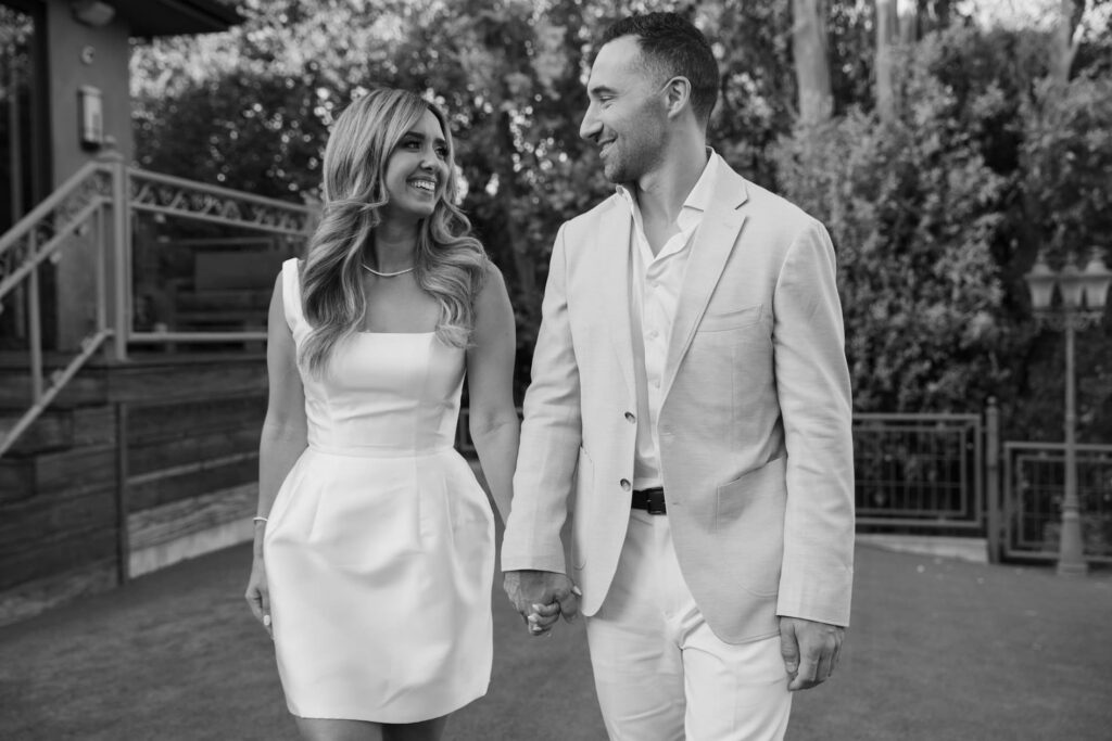 Engaged couple walking hand in hand at Los Gatos private estate engagement party, Bay Area engagement party photographer Rose Freedman