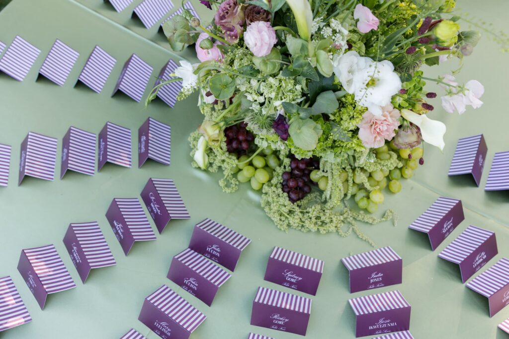 Purple striped wedding placecards with fruit and floral centerpiece at Park Winters wedding reception, Rose Freedman Photography