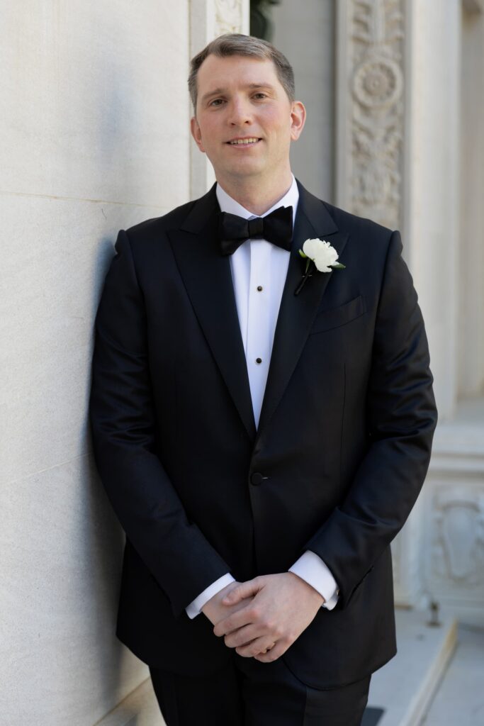 Groom portrait in black tuxedo at Flood Mansion San Francisco, San Francisco wedding photographer Rose Freedman