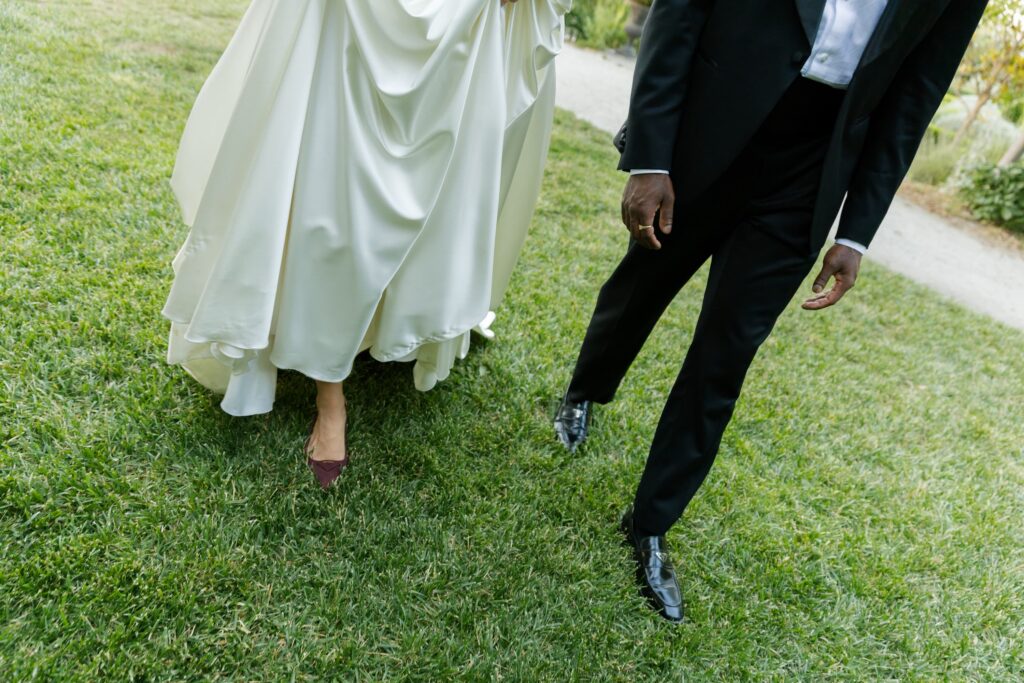 Bride and groom walking on grass at Park Winters wedding, Rose Freedman Photography