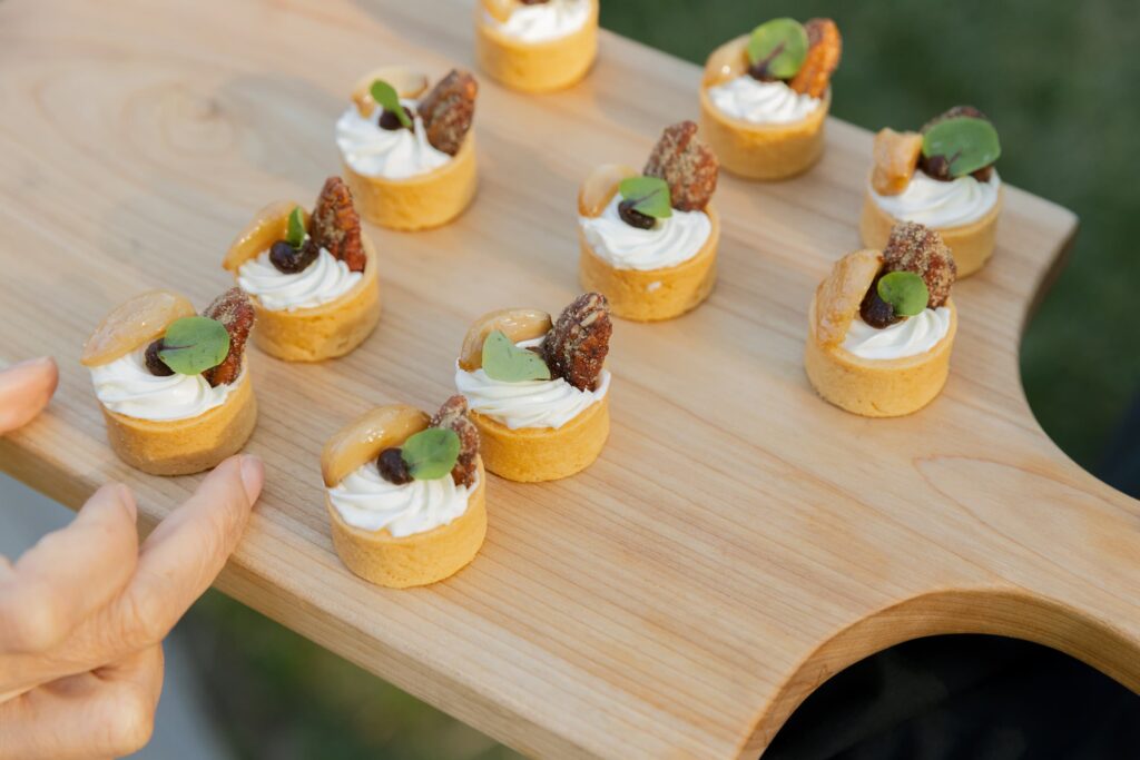 Wedding cocktail hour hors d'oeuvres on wooden board at Park Winters, Rose Freedman Photography