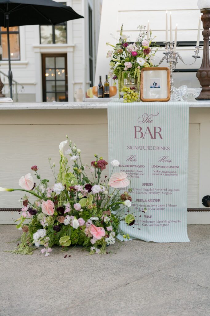 Wedding bar setup with signature drink menu sign and garden florals at Park Winters, Park Winters wedding photographer Rose Freedman