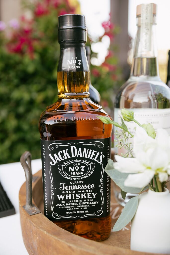 Bar detail with Jack Daniels whiskey and white florals at Los Gatos engagement party, Rose Freedman Photography