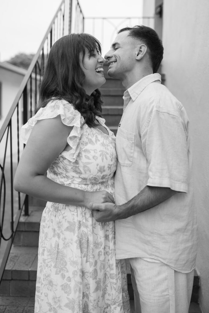 Couple leaning together downtown Half Moon Bay anniversary session, Rose Freedman Photography