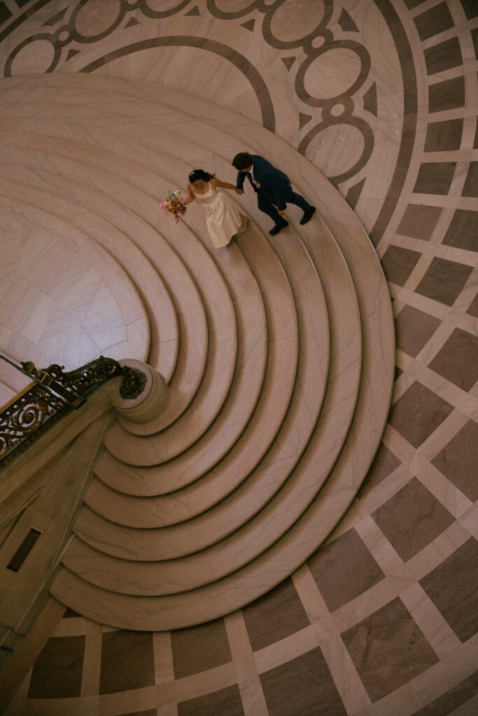 Aerial view couple on spiral staircase San Francisco City Hall elopement, Rose Freedman Photography