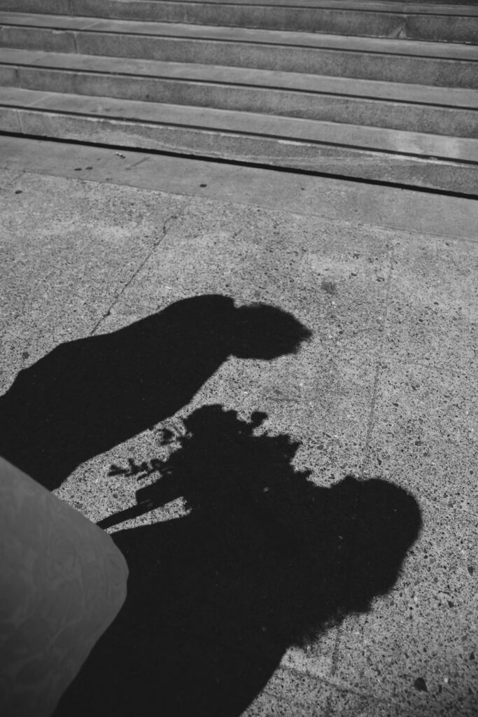 Shadow of couple kissing on San Francisco City Hall steps, artistic elopement photography Rose Freedman