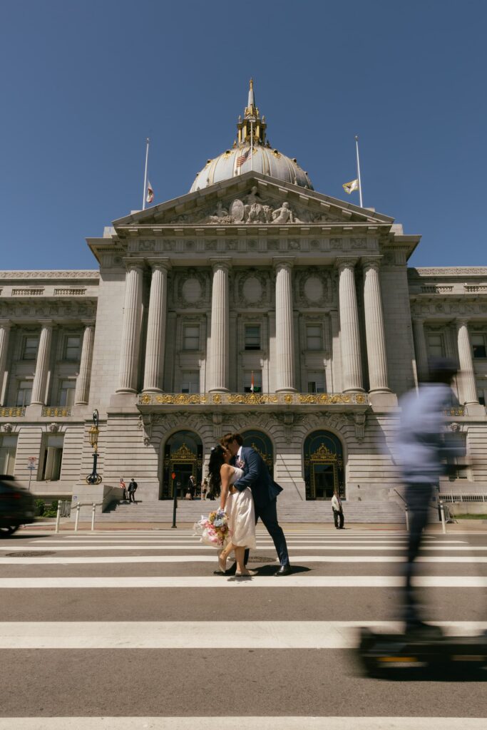 Couple kissing in crosswalk outside San Francisco City Hall elopement, Rose Freedman Photography
