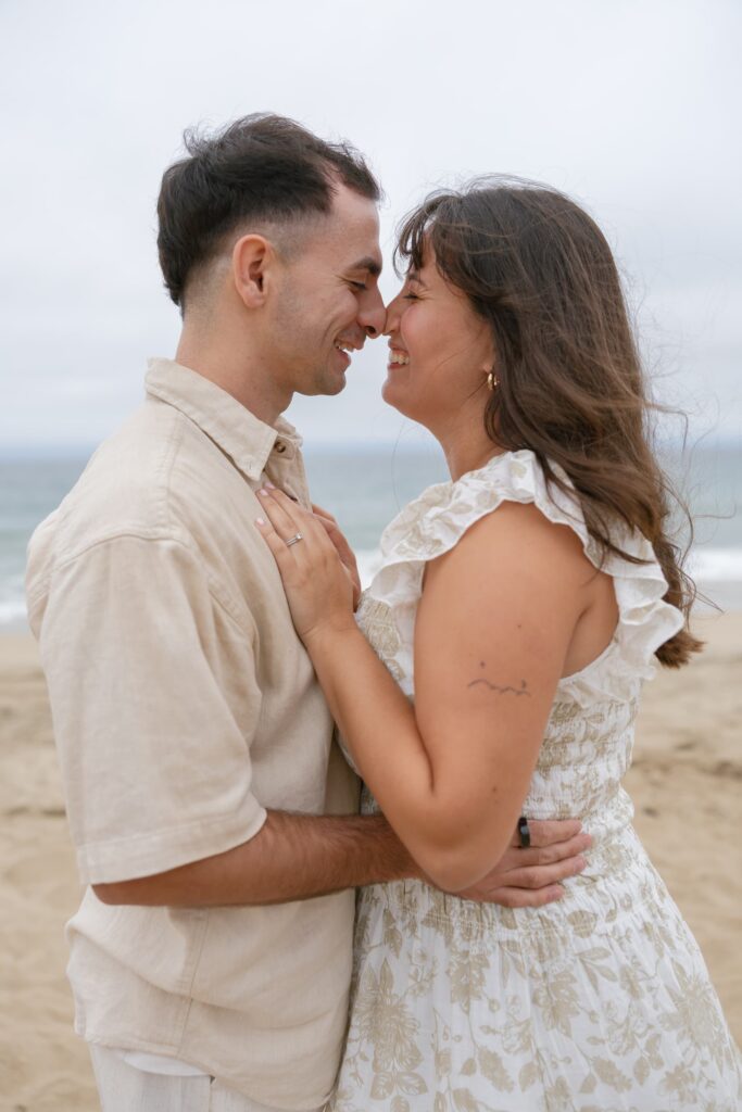 Couple standing on Half Moon Bay beach, Bay Area couples photographer Rose Freedman