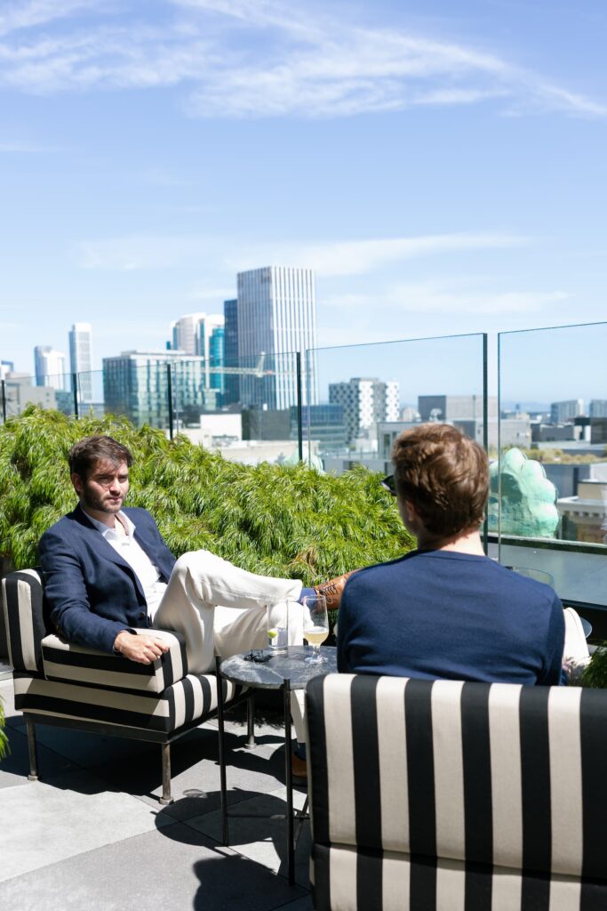 Guests seated on Charmaine's Rooftop San Francisco launch party, Rose Freedman Photography