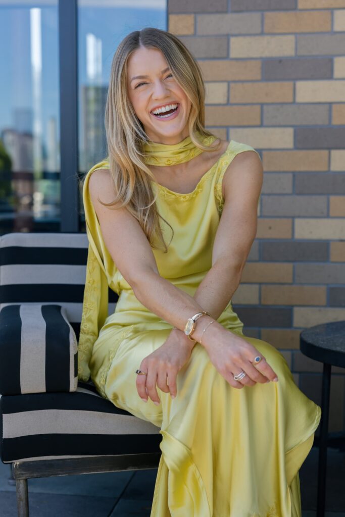 Wedding planner Liv Carter of Adored Creations laughing at launch party Charmaine's Rooftop, Rose Freedman Photography