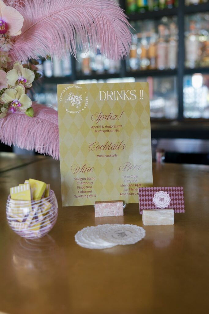 Adored Creations launch party drinks menu with pink ostrich feathers Charmaine's Rooftop, Rose Freedman Photography