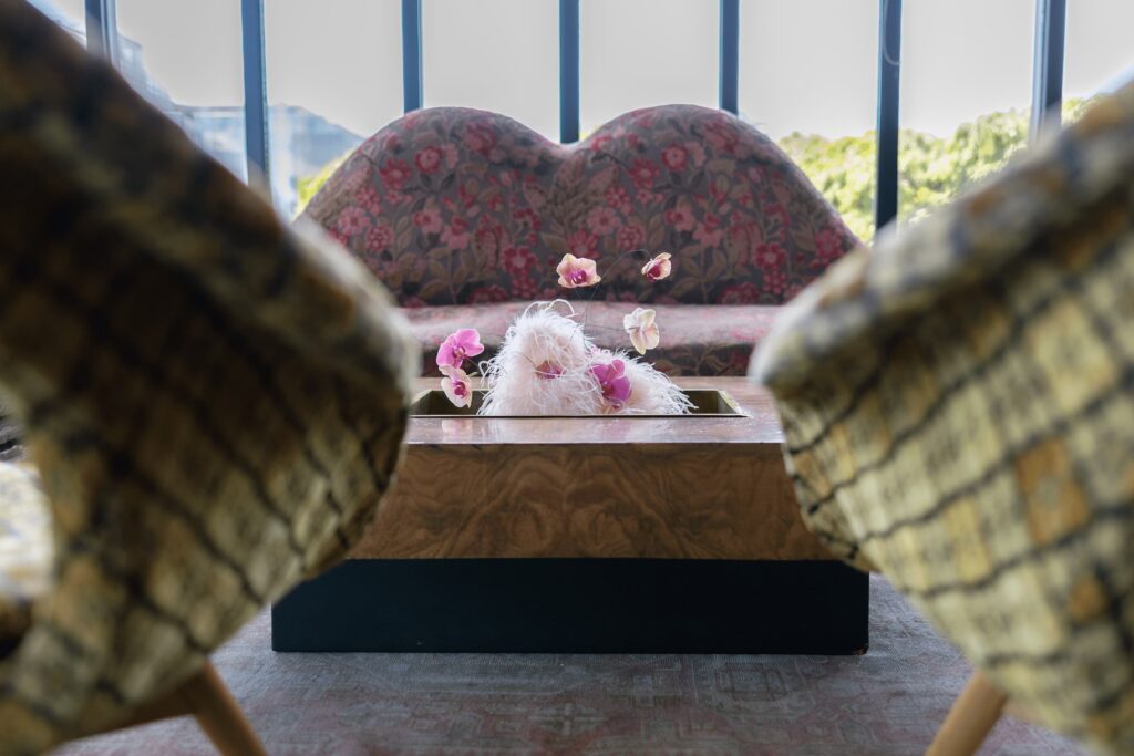 Pink orchid floral detail on velvet sofa Charmaine's Rooftop San Francisco, Rose Freedman Photography