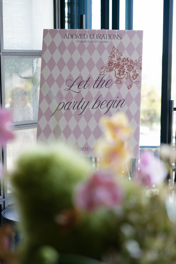 Adored Curations launch party welcome sign with florals San Francisco, event photographer Rose Freedman