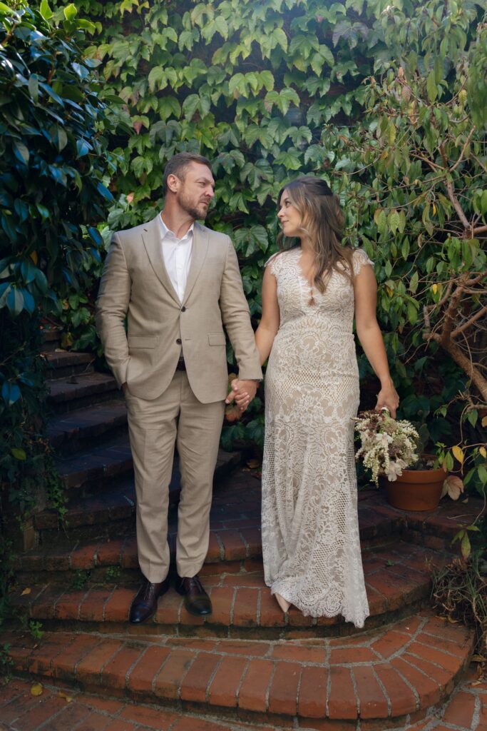 Couple holding hands in garden greenery Marin elopement portrait, Rose Freedman Photography