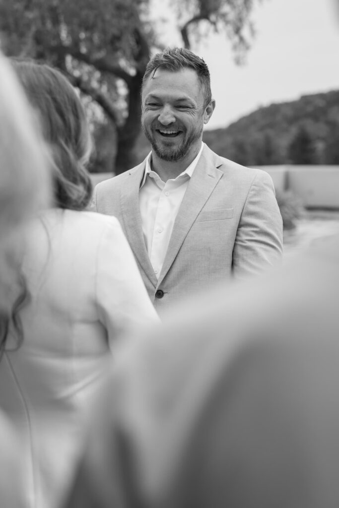 Groom laughing during elopement ceremony vows at Marin Civic Center, Rose Freedman Photography